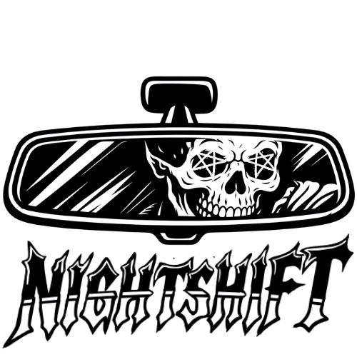 A car's interior view from the back seat showing the rearview mirror and the front dashboard.