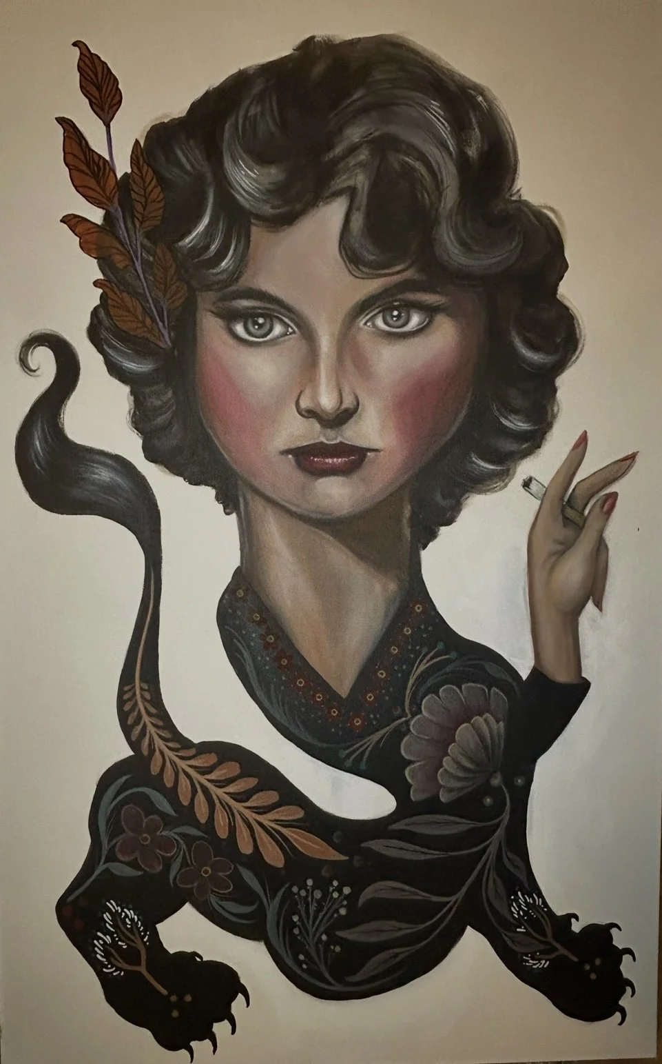 A surreal illustration of a woman with curly black hair, holding a cigarette, with a dark floral-patterned lizard body, and leaves in her hair, set against a beige background.
