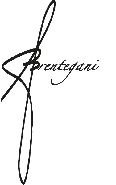 A black background with a signature-style logo that says 'Brentegani' intersected by a vertical line or swoosh.