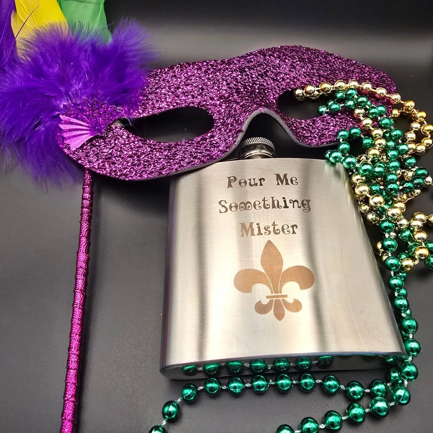 Laissez les bons temps roll 🎭 
Custom Mardi Gras flasks&mdash;engraved just for you and available online for a limited time.

🛍️ etchedinessence.com

#EtchedInEssence #MardiGrasKeepsake
#CustomEngraved #NewOrleans #BatonRouge