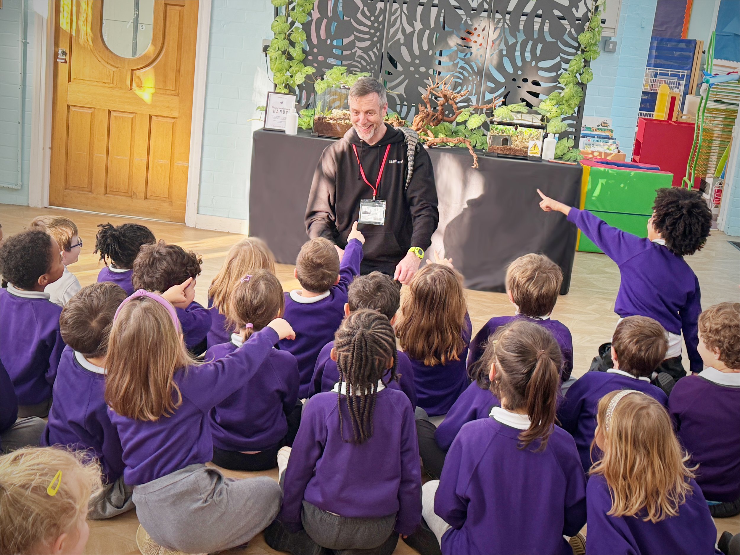 Primary school reptile workshop with children seated and engaged during a curriculum-aligned classroom session