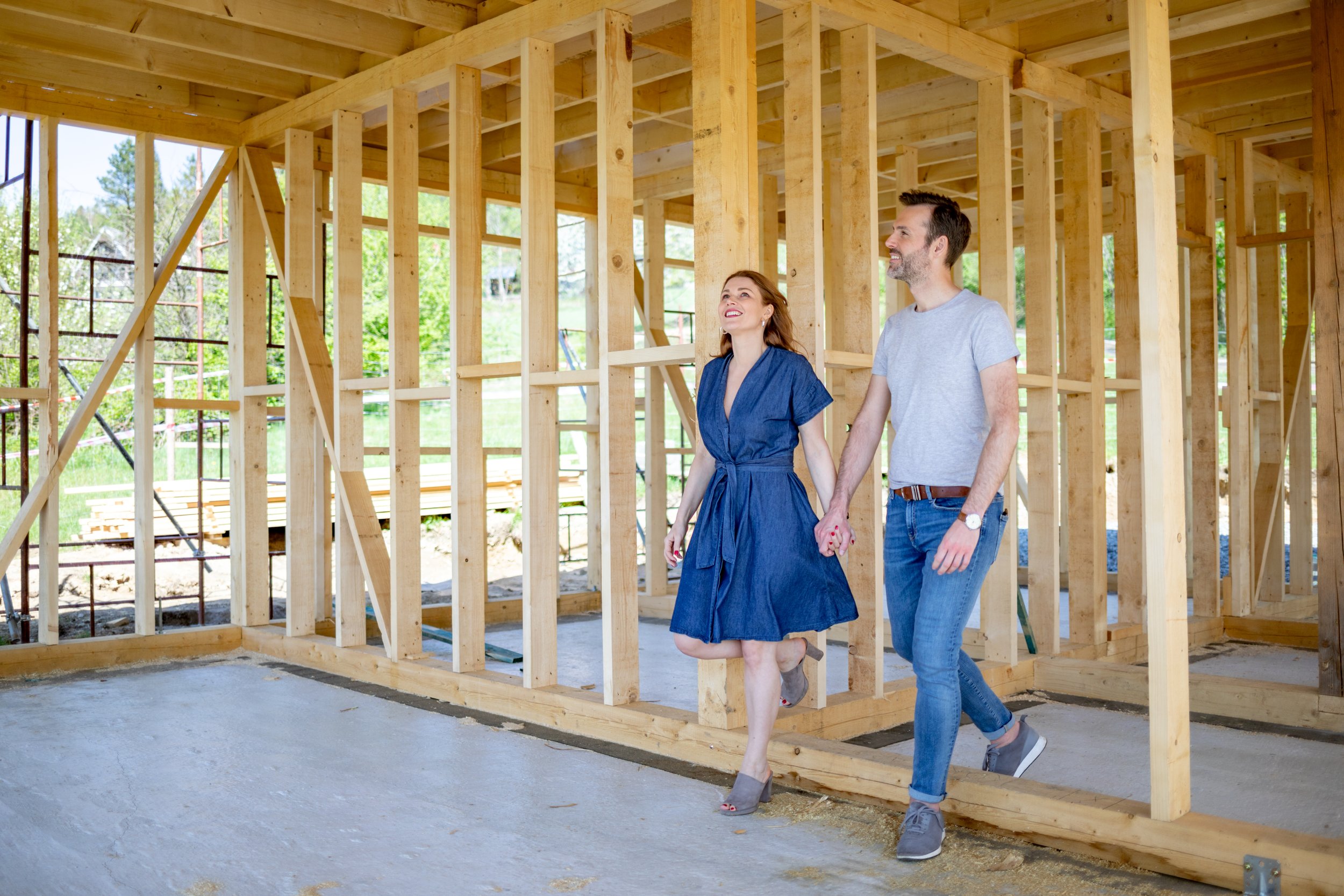 Couple walking through their home remodel