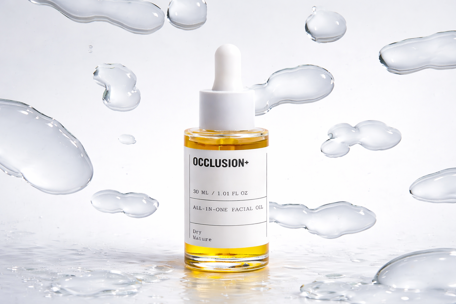 A bottle of facial oil labeled 'OCCLUSION+', with a white dropper cap, surrounded by water splashes on a reflective surface.