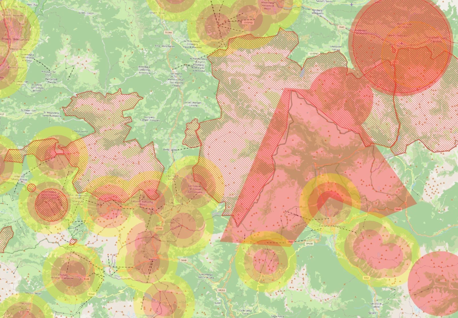 A detailed map showing various shaded areas, lines, and circles in red, yellow, and green, likely depicting geographic features, zones, or data points on a landscape with place names in Italy.