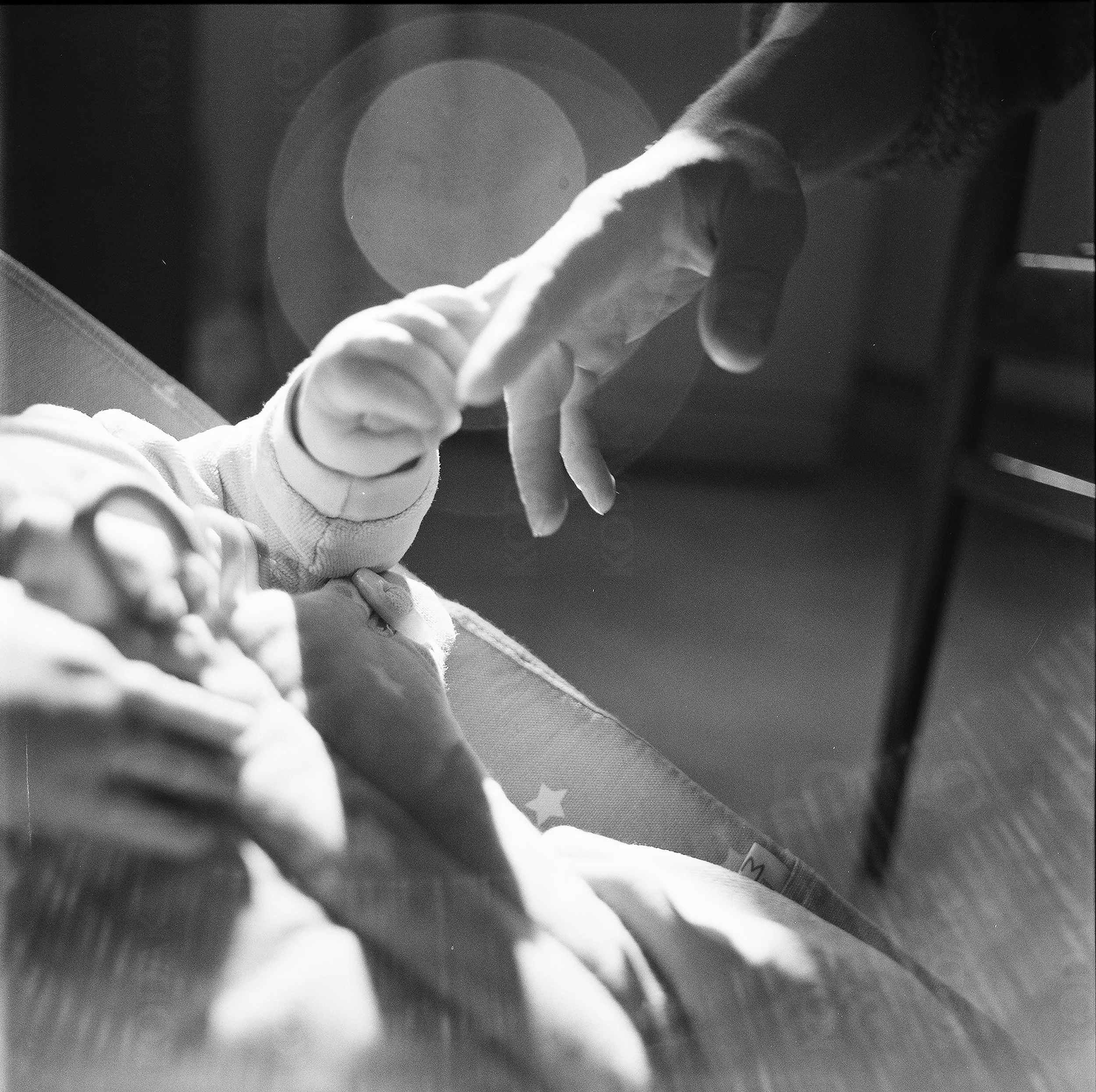birth trauma therapy fort collins, trauma therapist for moms, baby holding parents hand