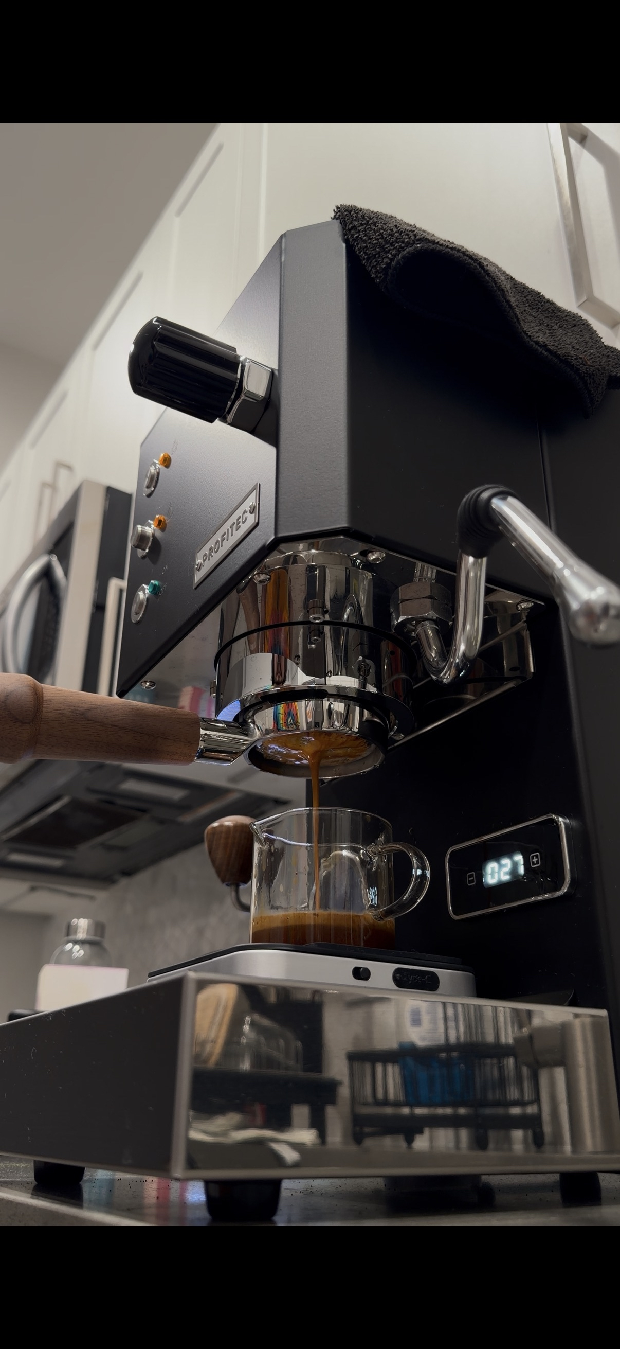 Pulling an espresso shot.