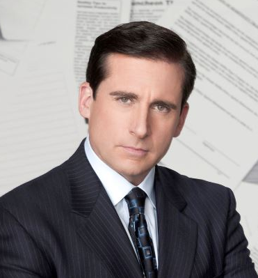 Professional man in a suit with papers in the background.