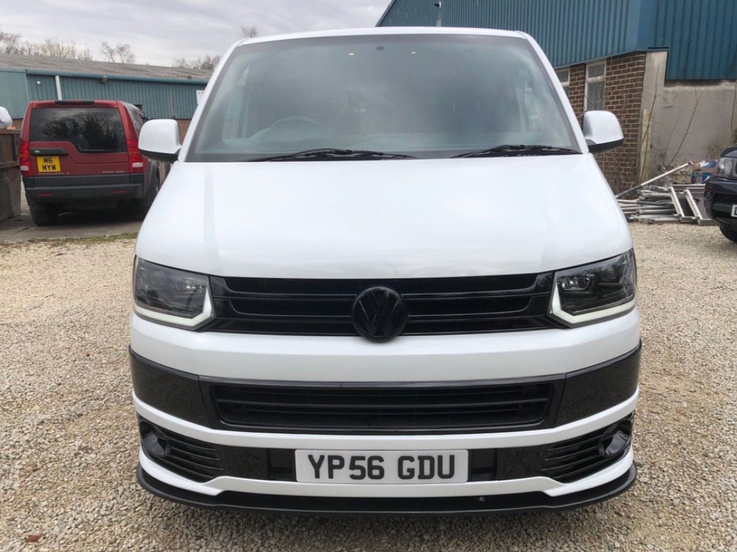 Front of the finished van showing new headlights and gloss black grills 