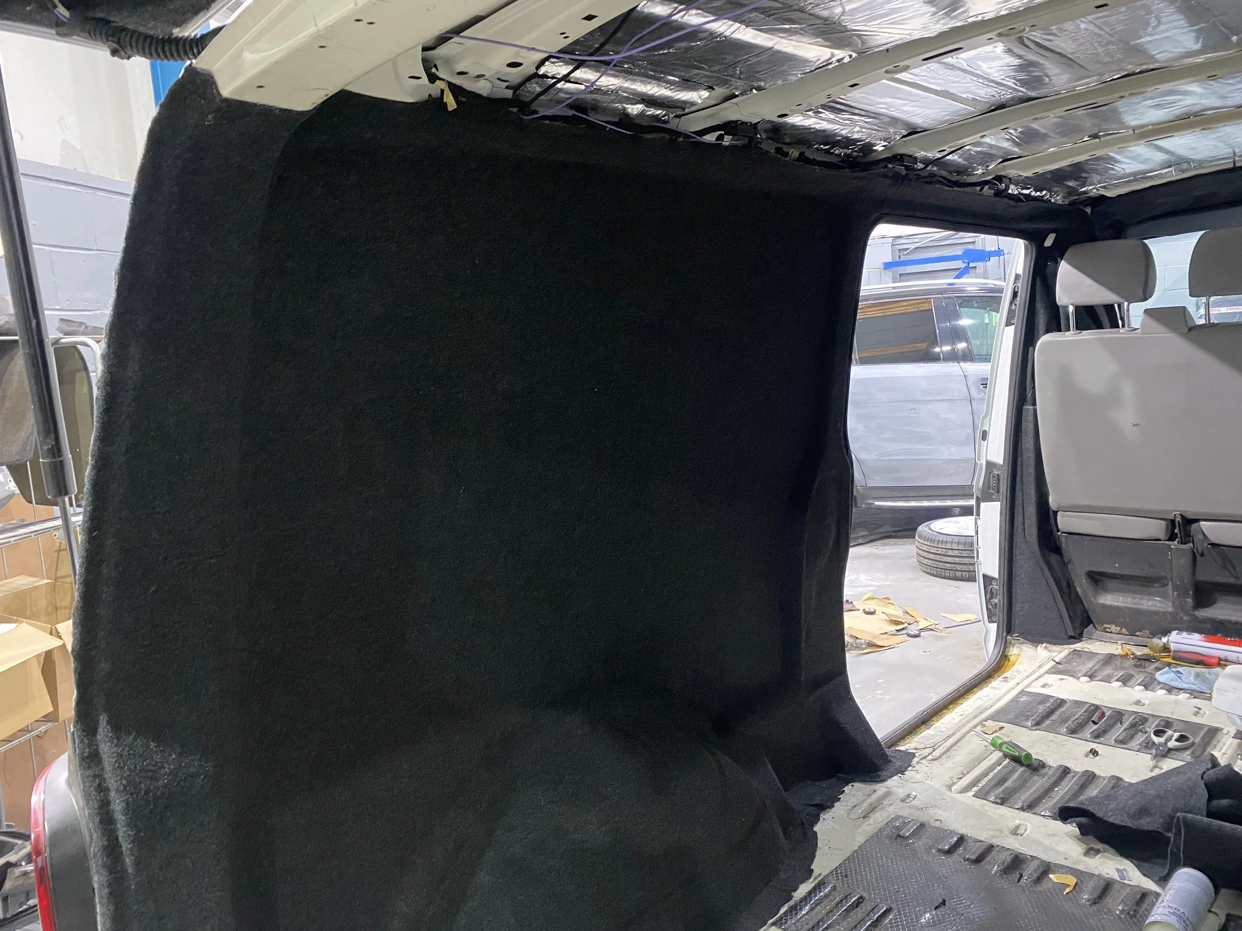 Carpet going on the side of the van