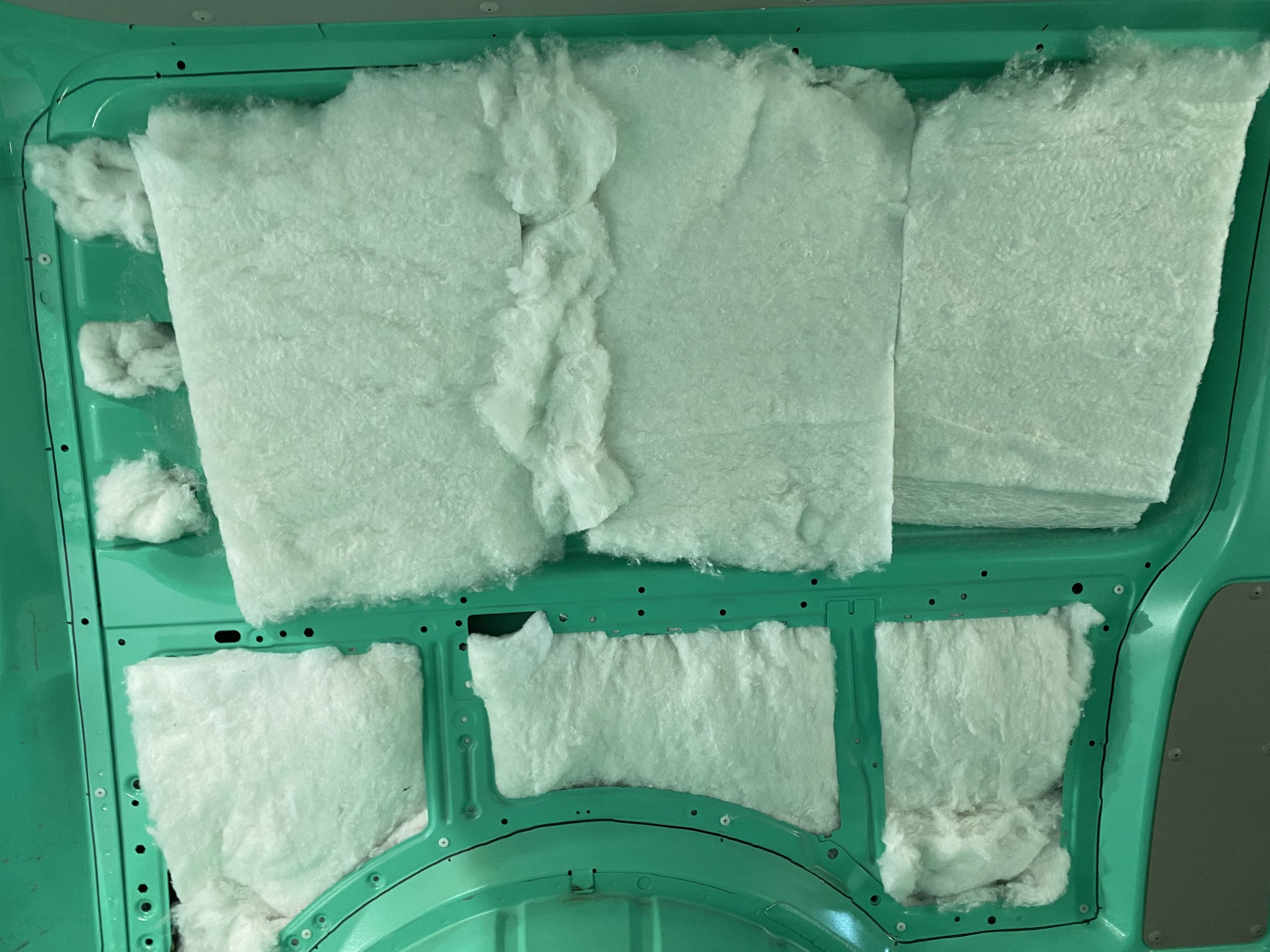 Insulation panels installed inside a vehicle roof