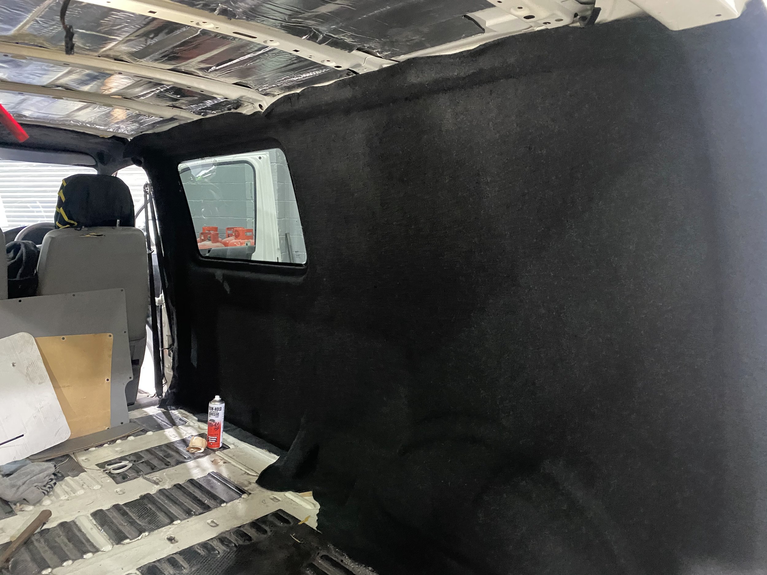 Carpet going on the side of the van