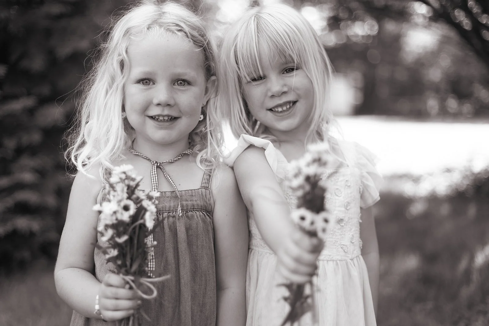 Children making flower bouquets at home during family photo session