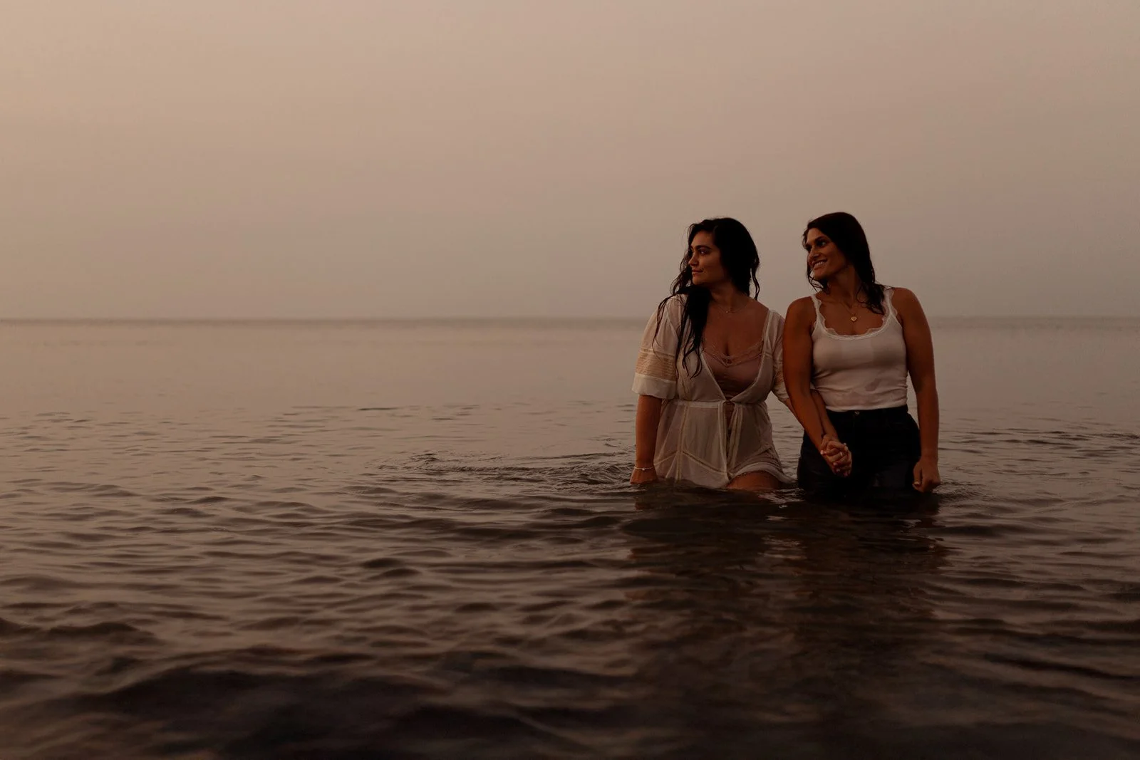 Cinematic LGBTQ+ couples photography in Cape Cod with warm tones and natural movement, ideal for anniversary or engagement sessions