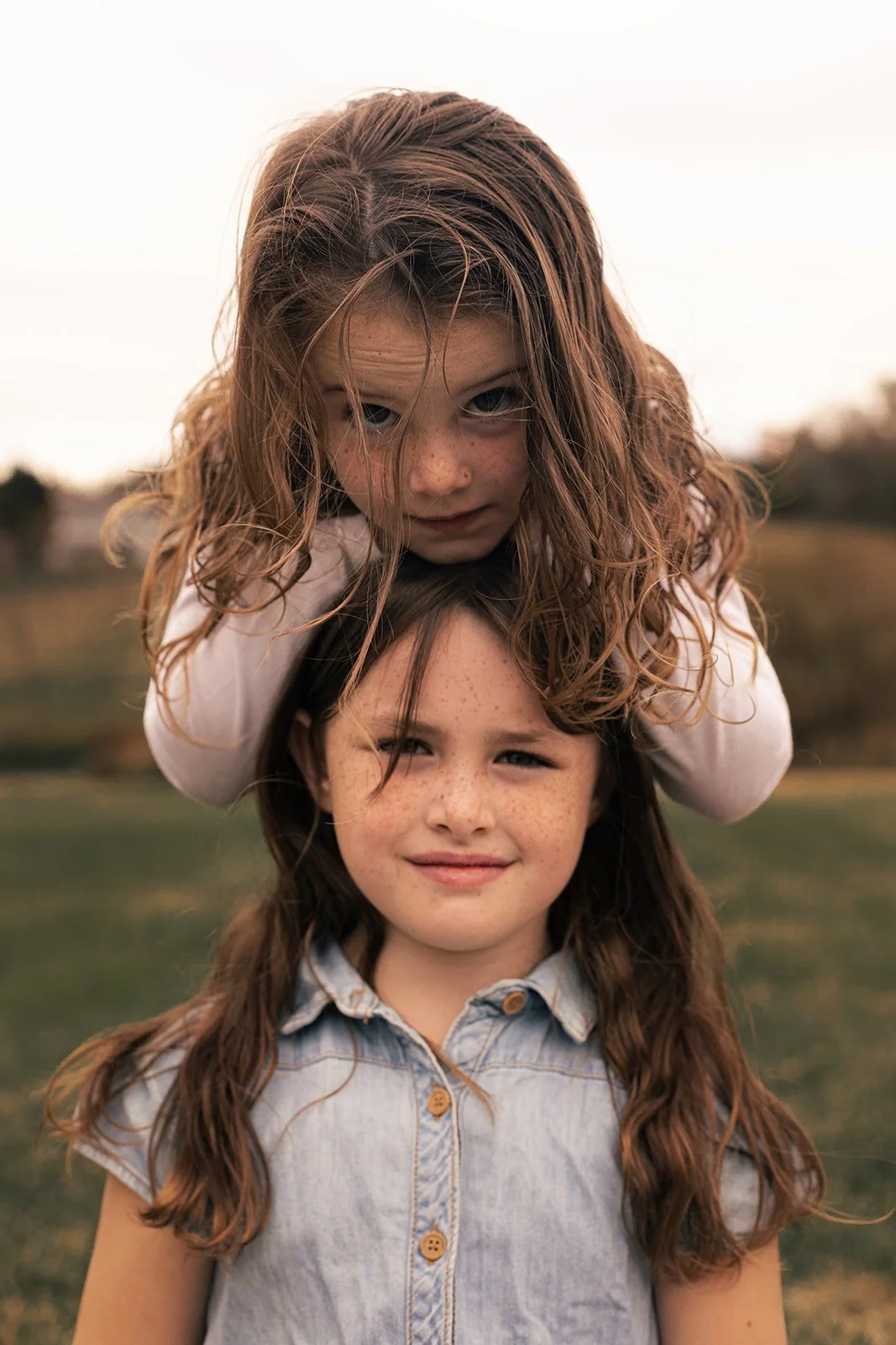 Playful family photography session with children and animals in Doylestown PA, capturing connection and personality