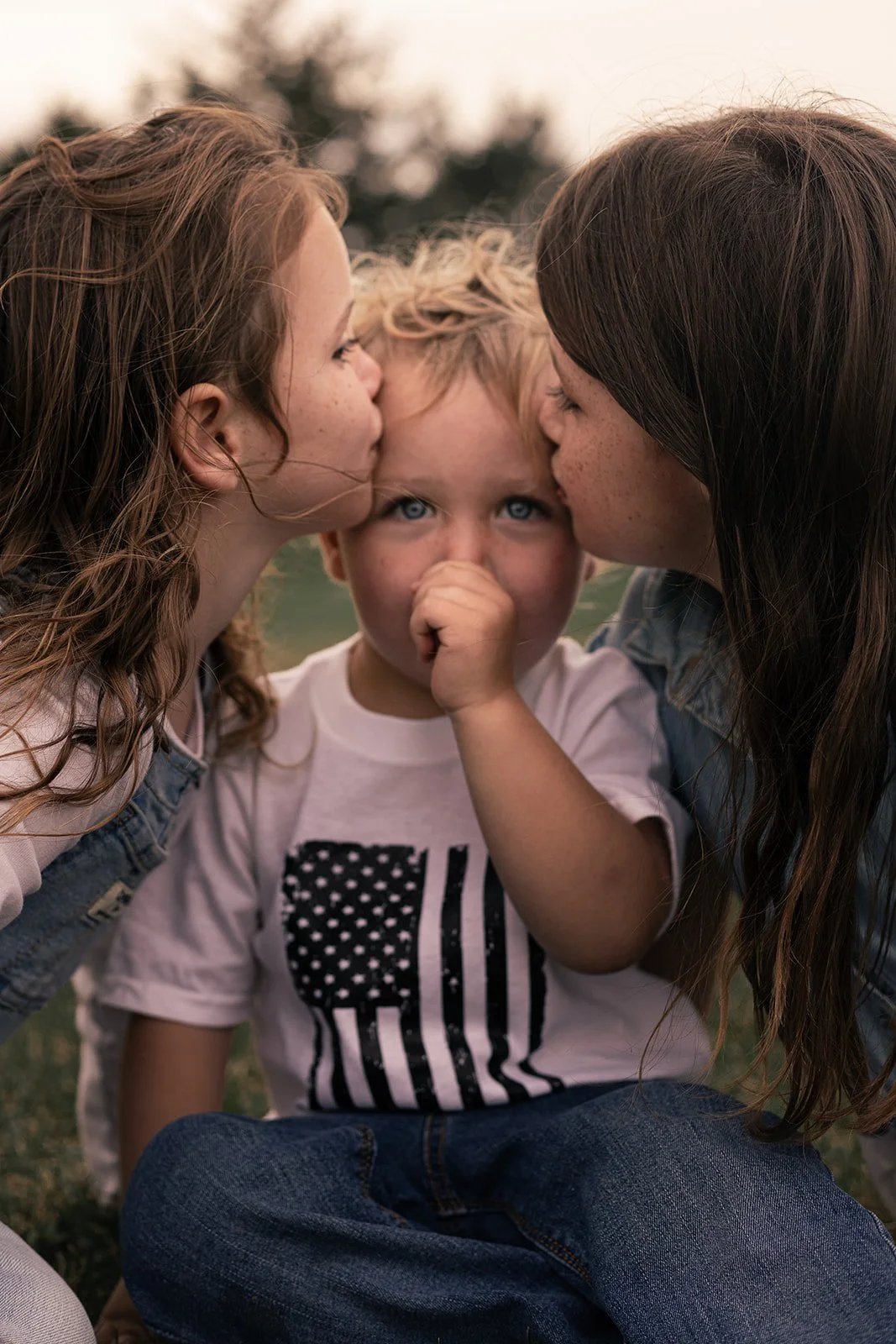 Candid moment of siblings playing together during an at-home family session in Doylestown, PA