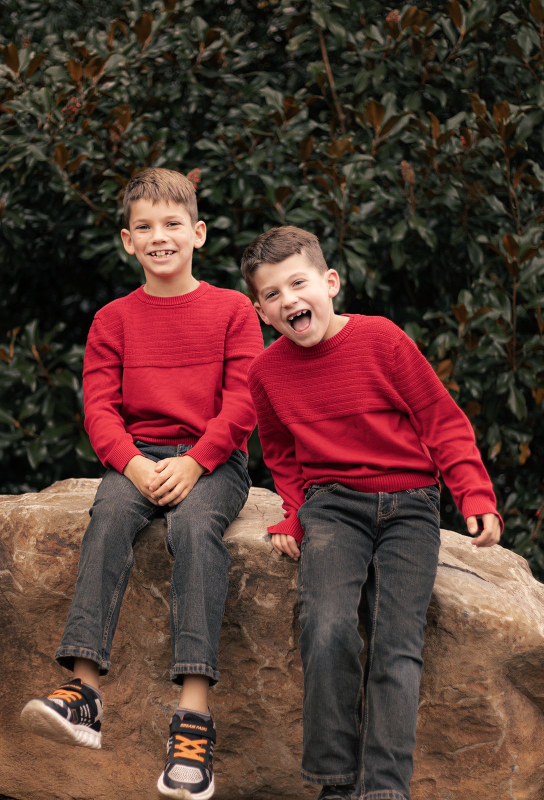Family of four walking together outdoors during a relaxed fall session in Doylestown, candid and natural family photography
