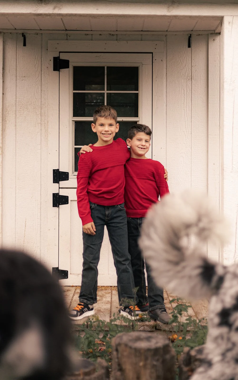 Candid moment of siblings interacting during a lifestyle family session in Doylestown, PA, relaxed and documentary style photography