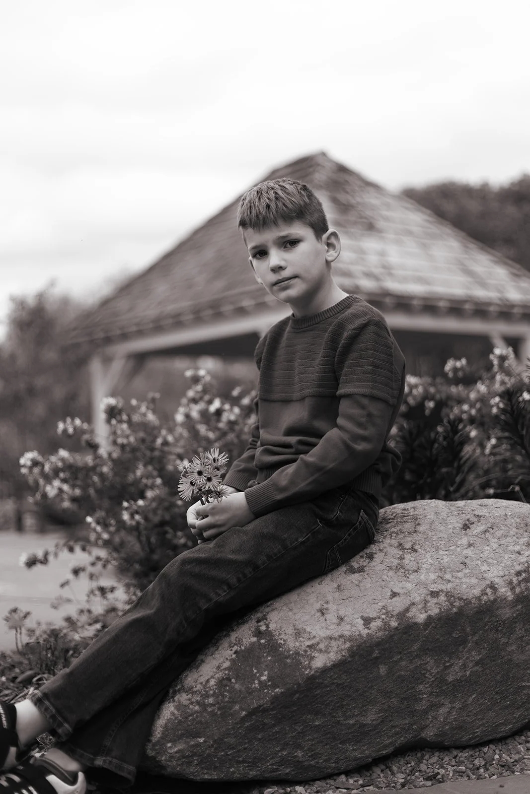 Candid moment of siblings interacting during a lifestyle family session in Doylestown, PA, relaxed and documentary style photography
