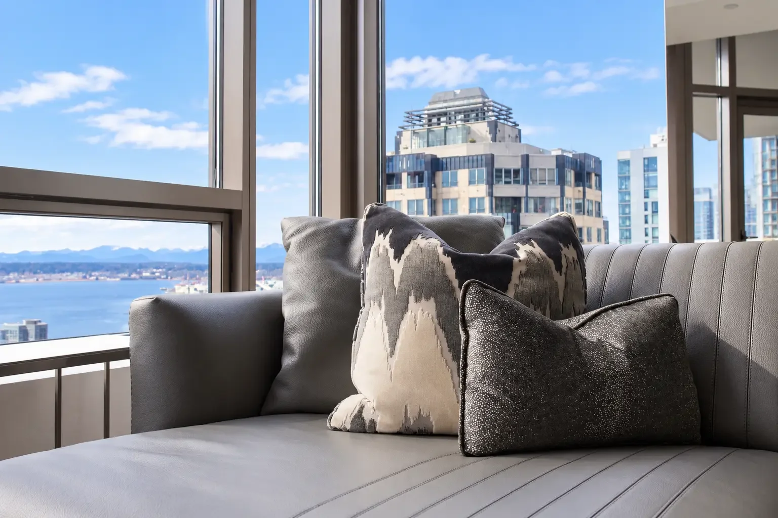 Modern Sofa with Waterfront City View.webp