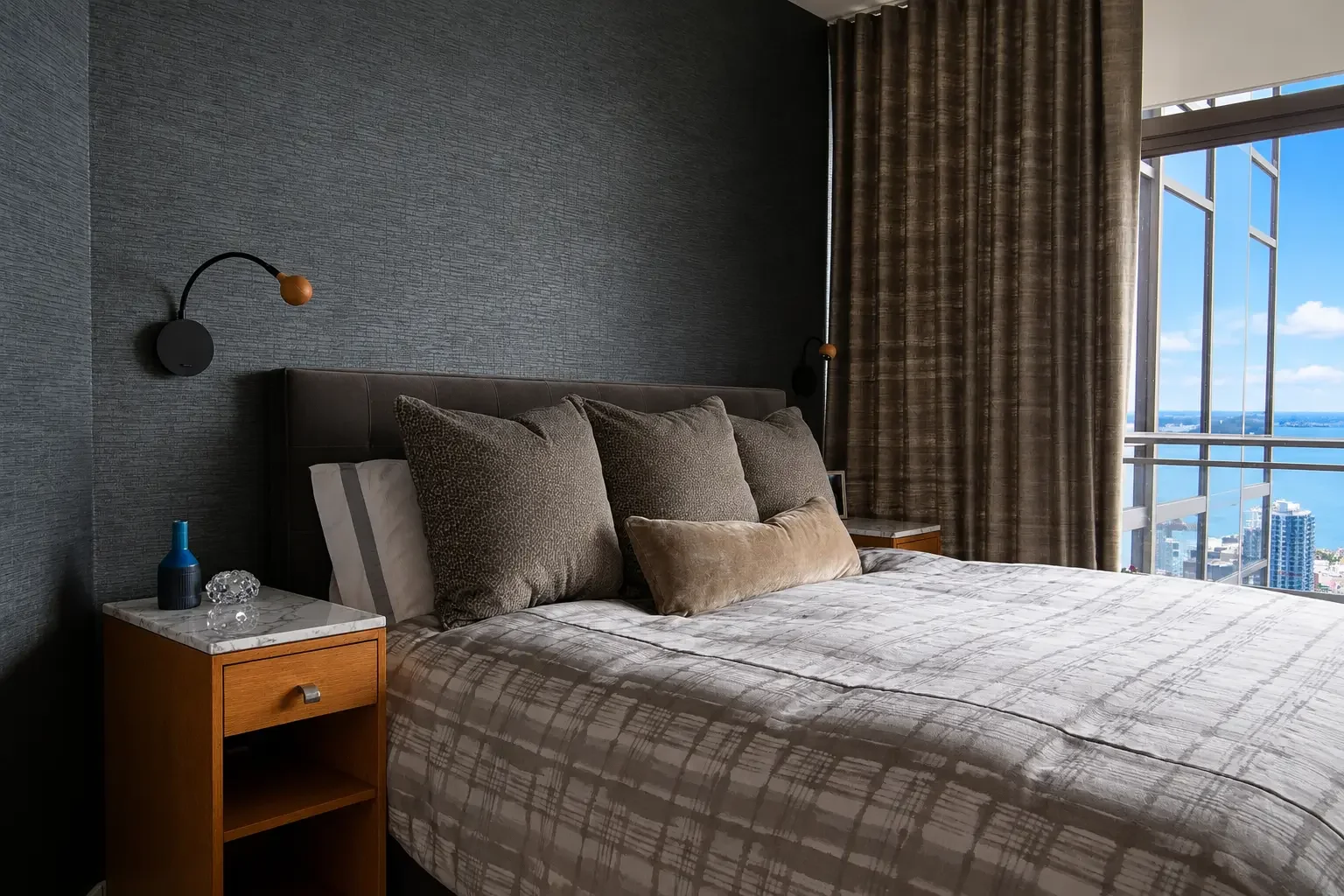 Moody Bedroom with Bright Skyline Views.webp