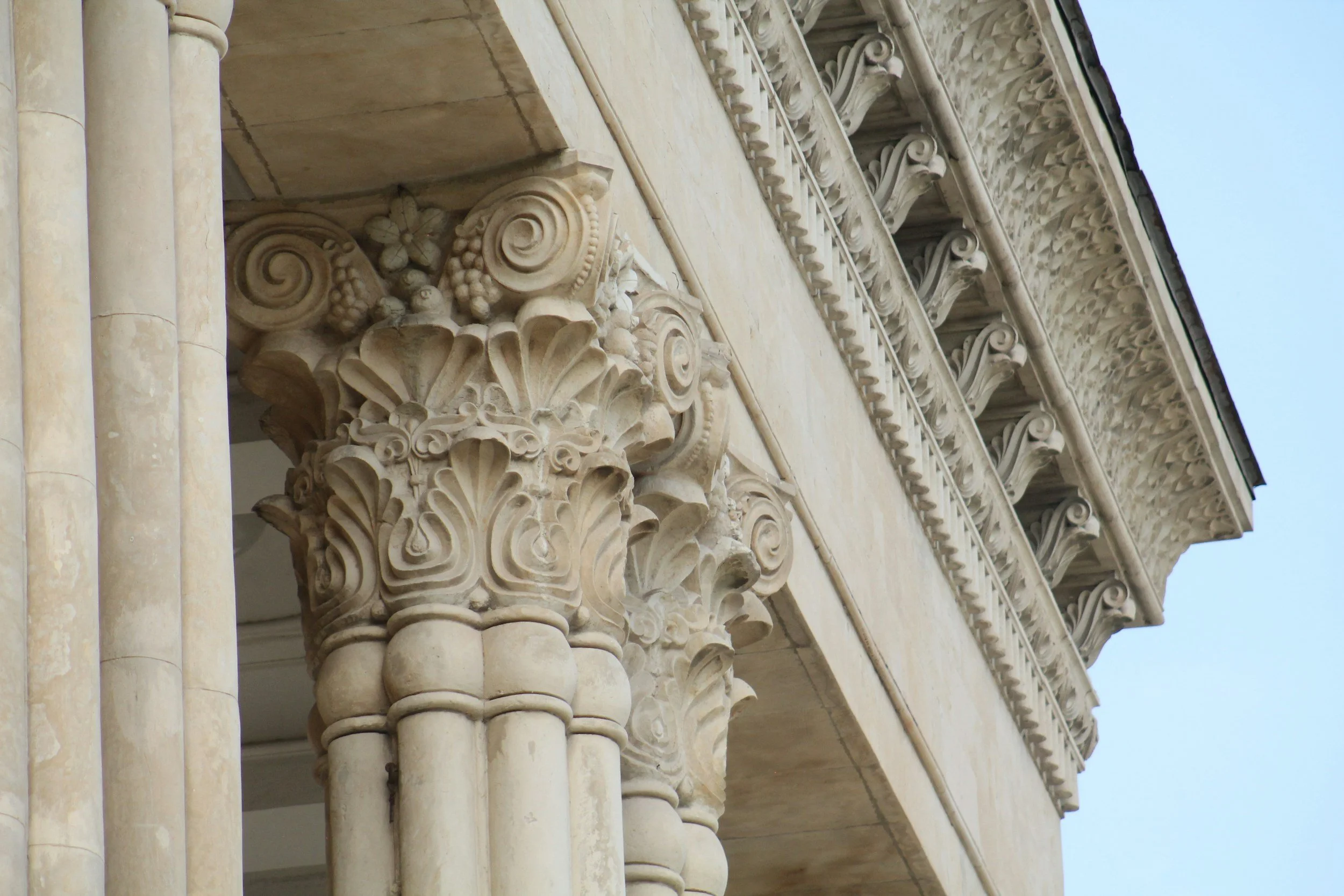 Ornate stone columns and architectural detailing on a classical building.