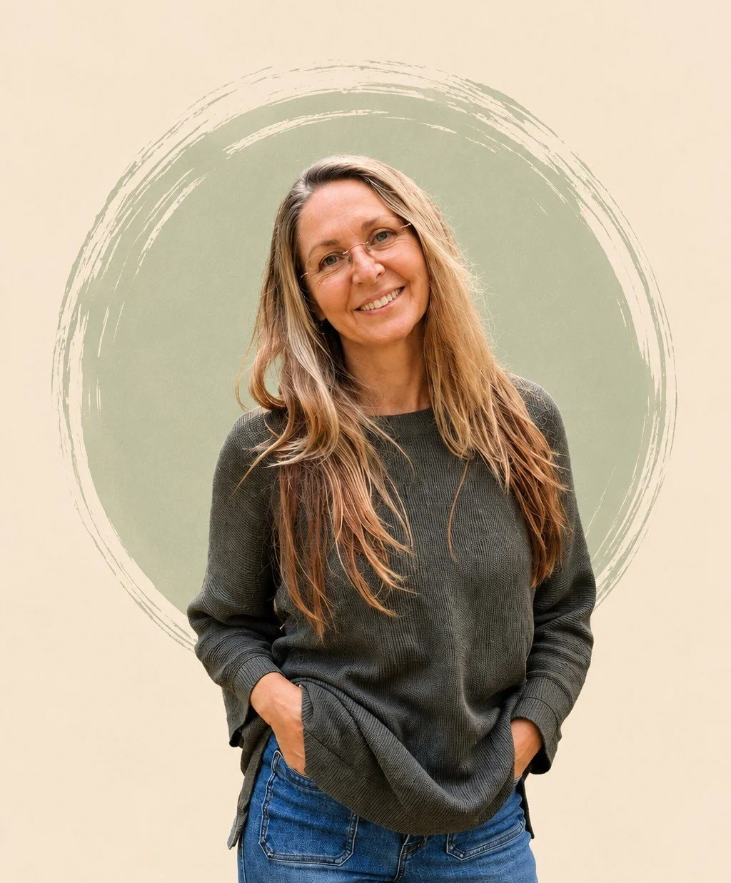 A woman with long, wavy, light brown hair and glasses smiling, standing with her hands in her pockets in front of a beige background with a green circular design.