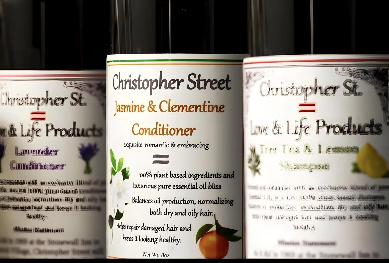 A close-up of a white bottle of Christopher Street Jasmine & Clementine Conditioner with a label that has green, orange, and black text. The label describes the product as exfoliating, romantic, and embracing with plant-based ingredients and luxurious essential oil bliss. There is a small image of a clementine fruit on the label.