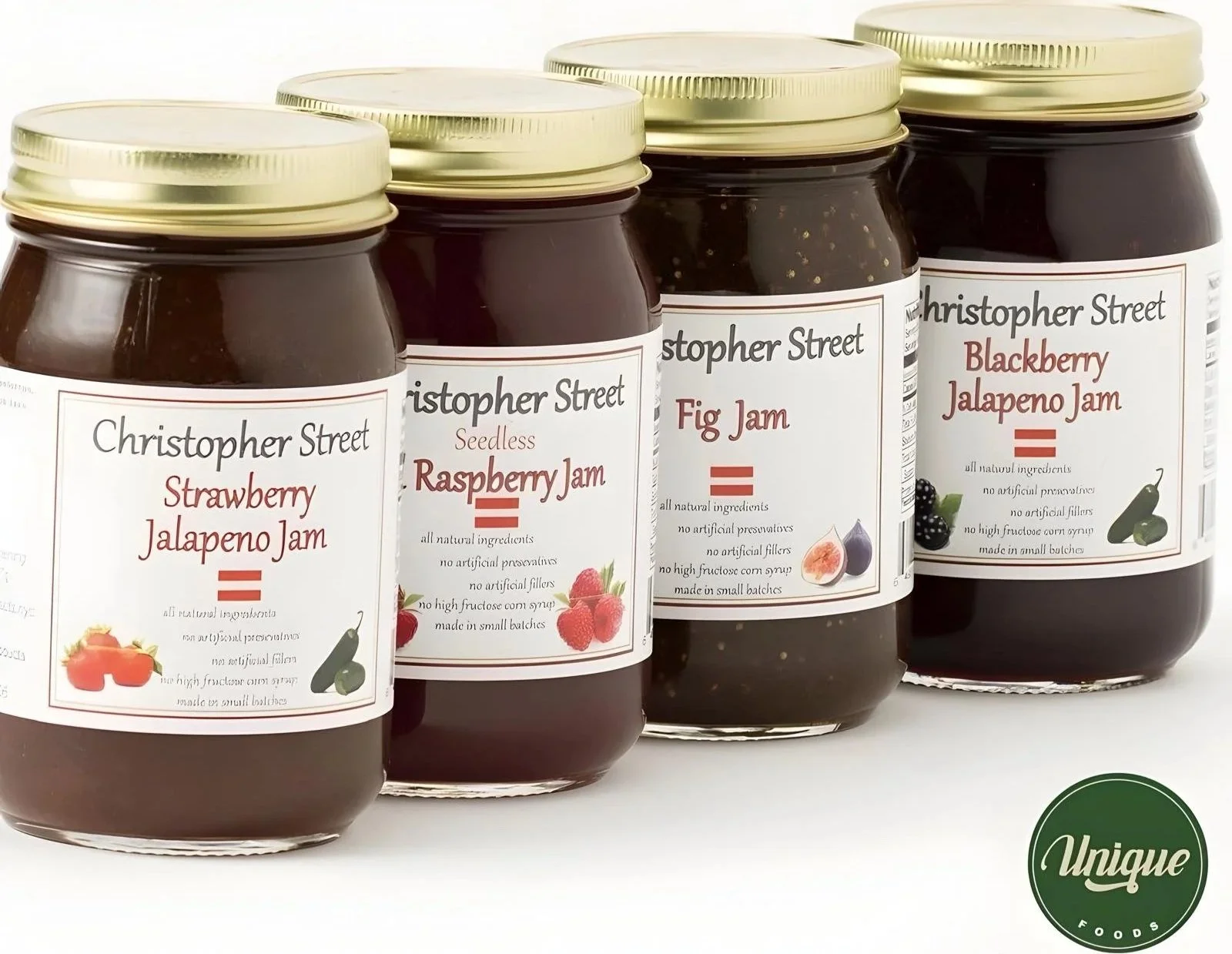 Four jars of Christopher Street jam flavors including strawberry jalapeno, raspberry seedless, fig, and blackberry jalapeno, with labels showing ingredients and small fruit illustrations.