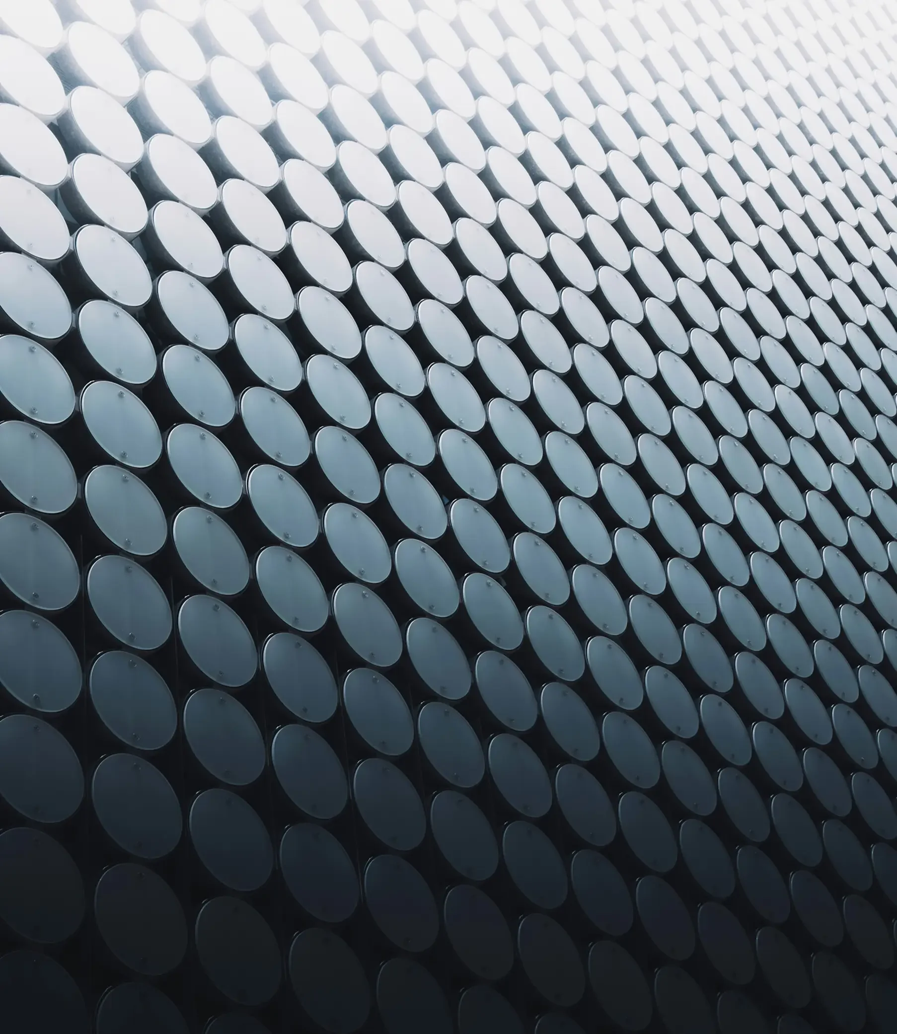 Close-up of a surface covered with repeating circular metallic discs.