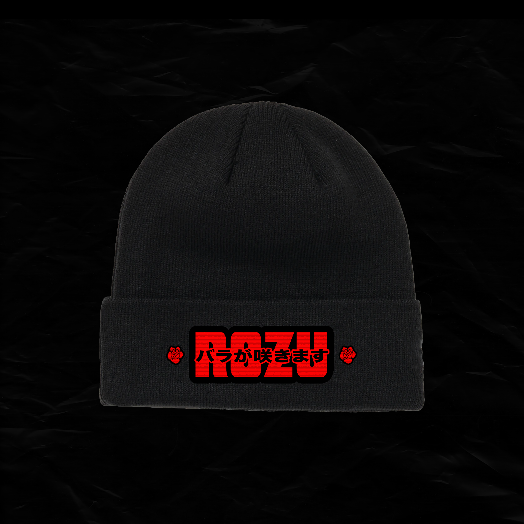 A black knit beanie hat with red and black embroidered design featuring the text 'ROZ' and Japanese characters, flanked by small red roses.