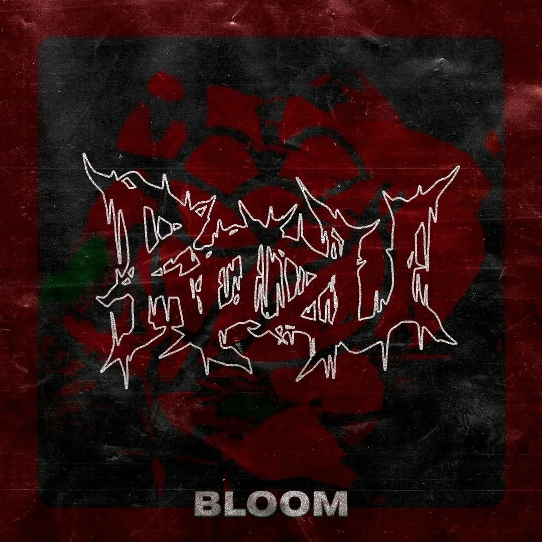 A black rectangular background with red roses and dark leaves, overlaid with a white outline of a wolf's face with sharp features, and the word 'BLOOM' in grey at the bottom.