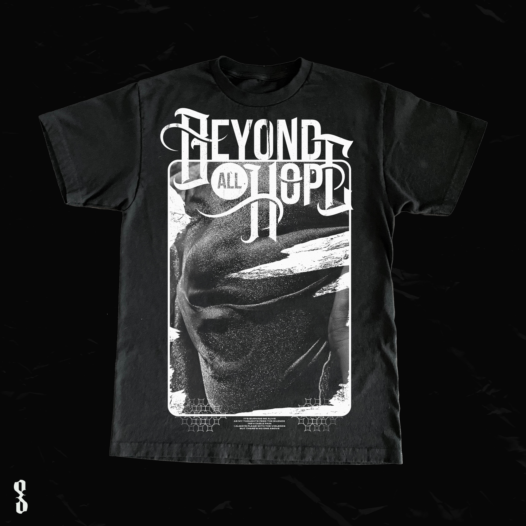 Black T-shirt with white graphic design featuring abstract face, stylized text reading 'Beyond All Hope' at the top, and additional smaller text and patterns below.