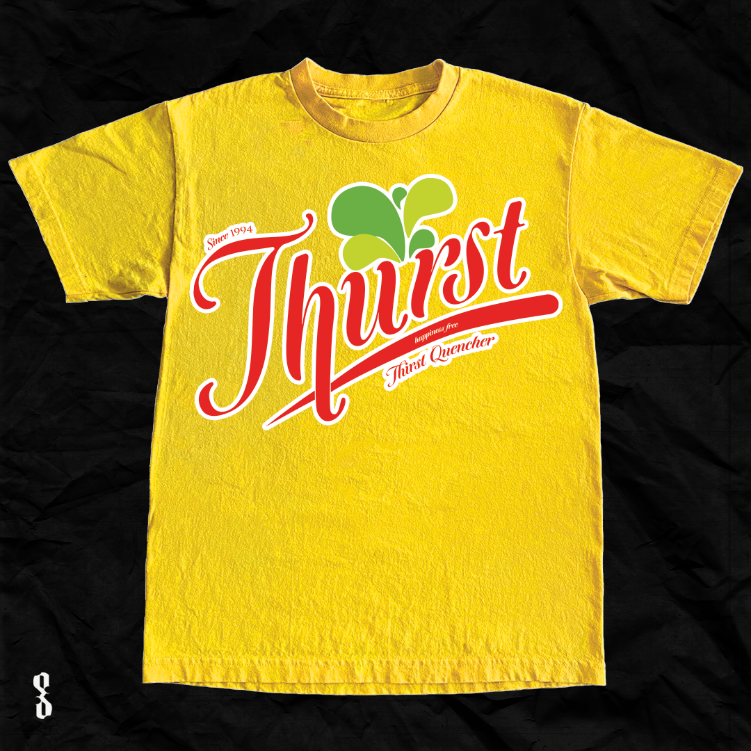 Yellow T-shirt with a colorful graphic design that says 'Thirst,' with a green leaf graphic above and red cursive text beneath reading 'since 1994,' 'happiness free,' and 'Thirst Quencher.'