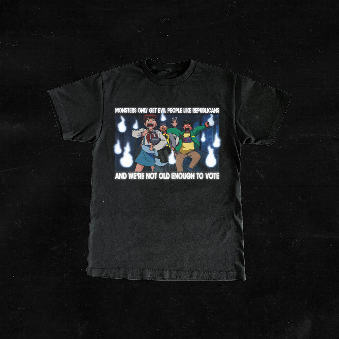 Black T-shirt featuring a cartoon scene with characters surrounded by flames, and text reading "Monsters only get evil people like Republicans and we're not old enough to vote."