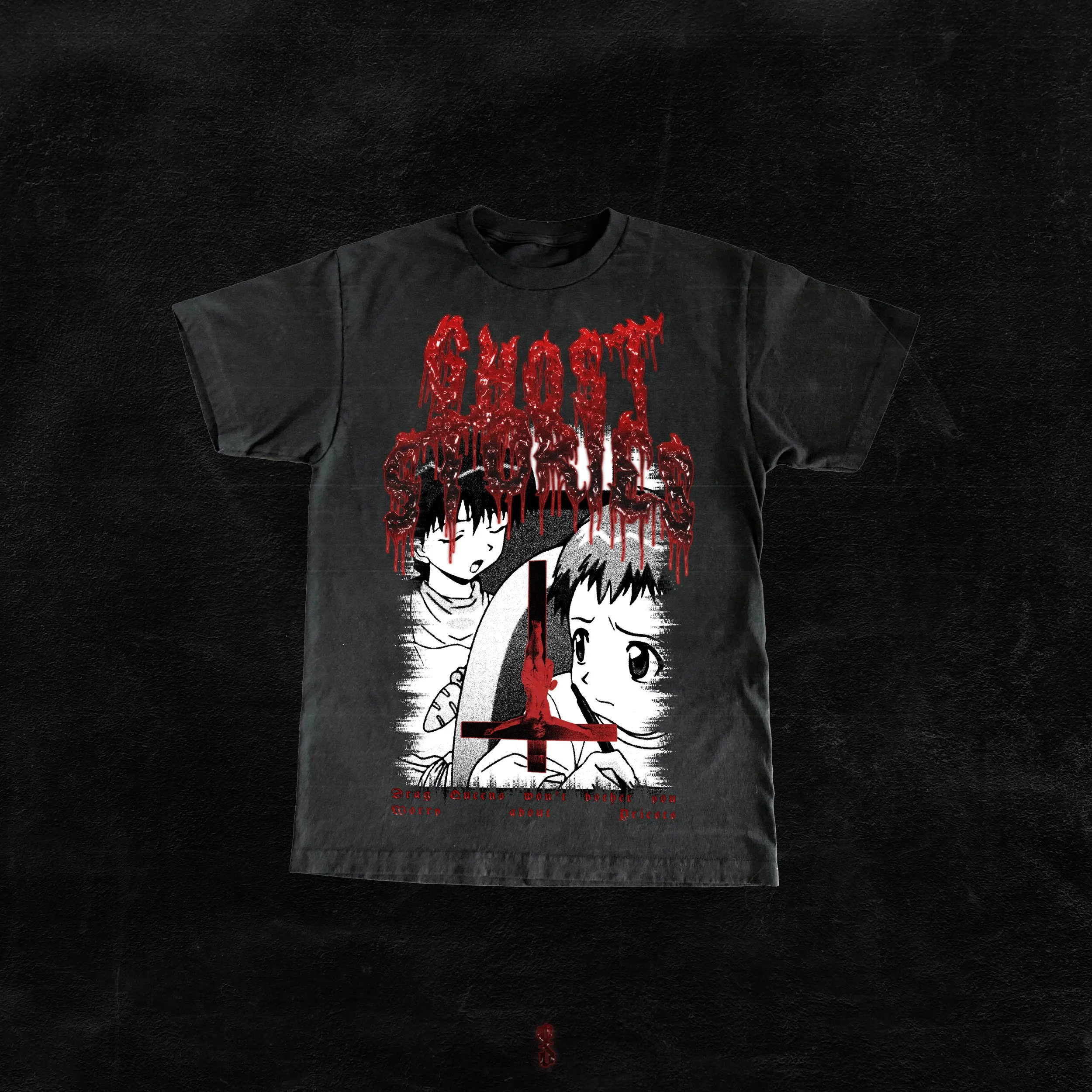 A black T-shirt featuring horror-themed manga-style artwork with two characters, one with dark hair and the other with short hair, and red dripping text that reads 'GHOST STORIES'.