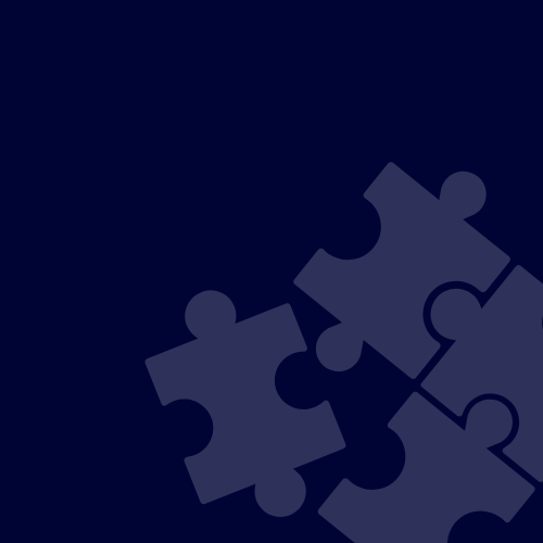 Part of a jigsaw puzzle on a dark background.