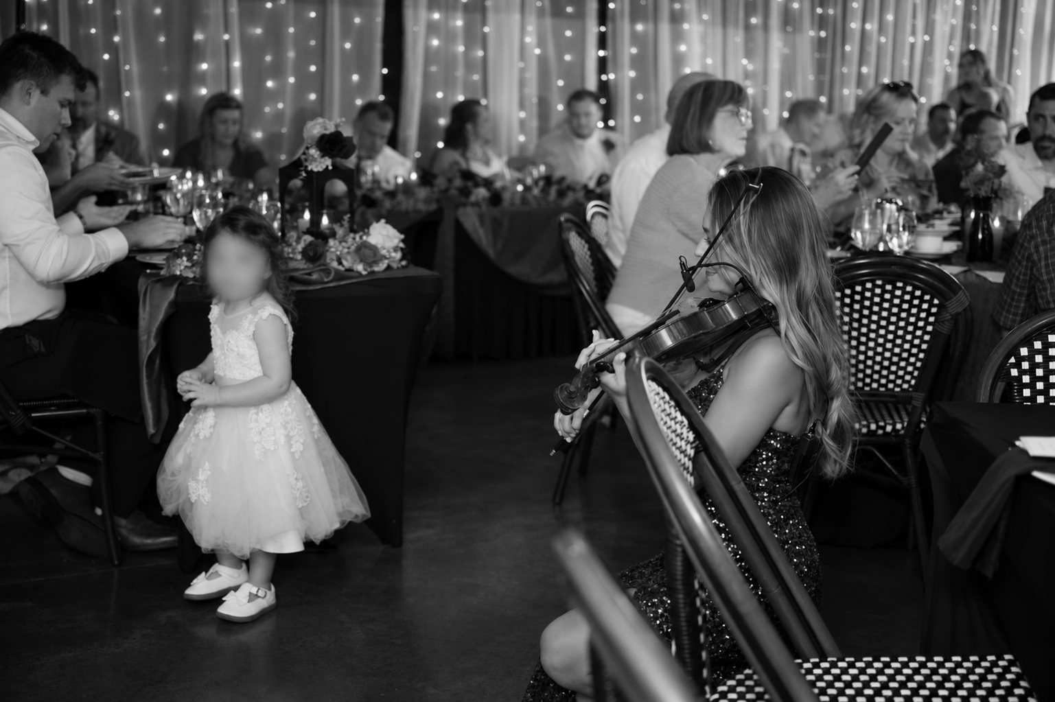 Warm+Wedding+Reception+with+Violinist+and+Flower+Girl.png