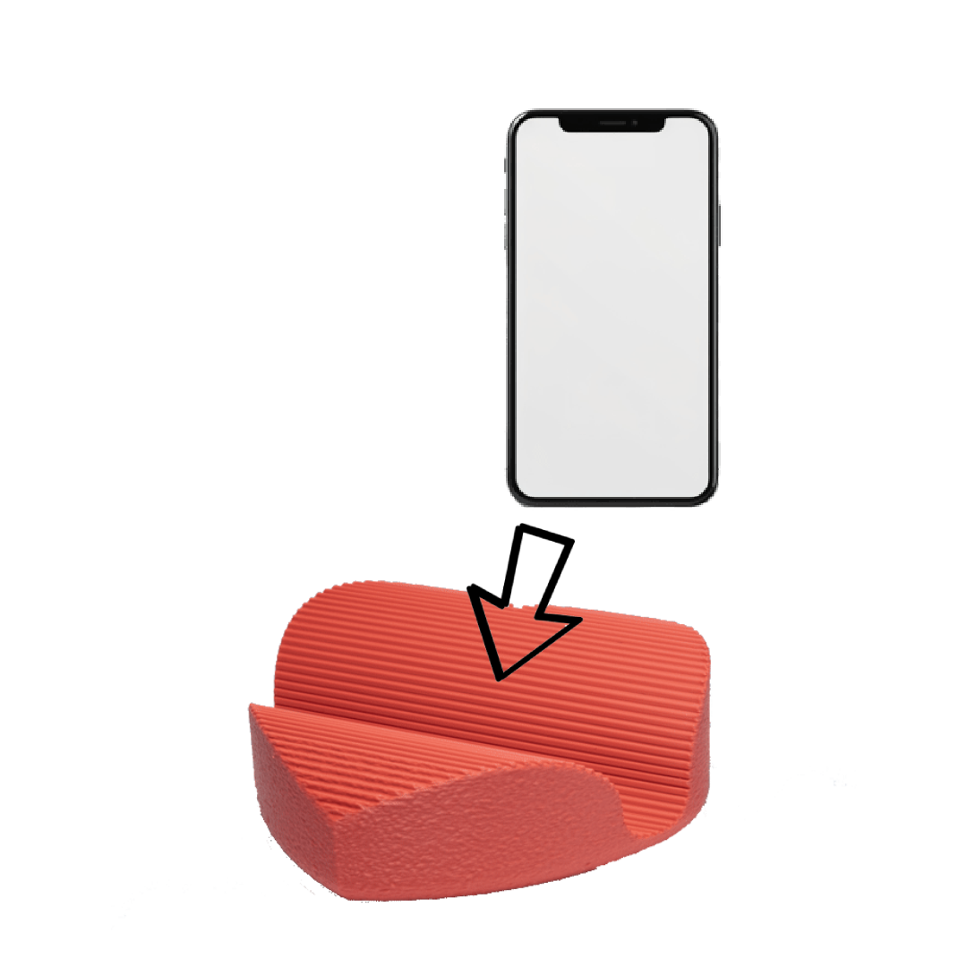 A children's red toilet training seat with a textured surface and a smartphone mounted above it, pointing downward.