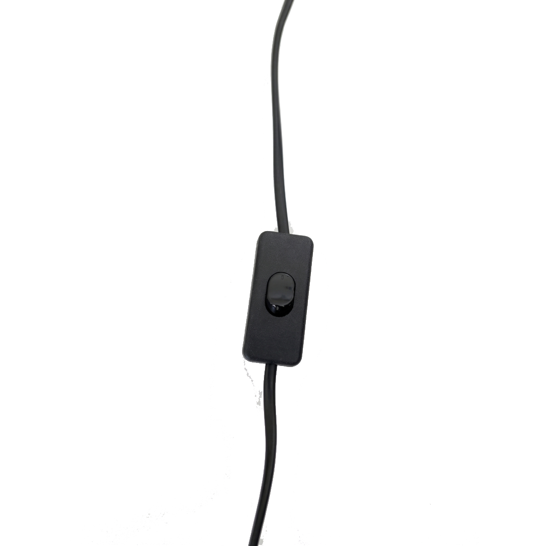 Close-up of a black electrical cord with a switch, plugged into an outlet, against a background of yellow and gray.