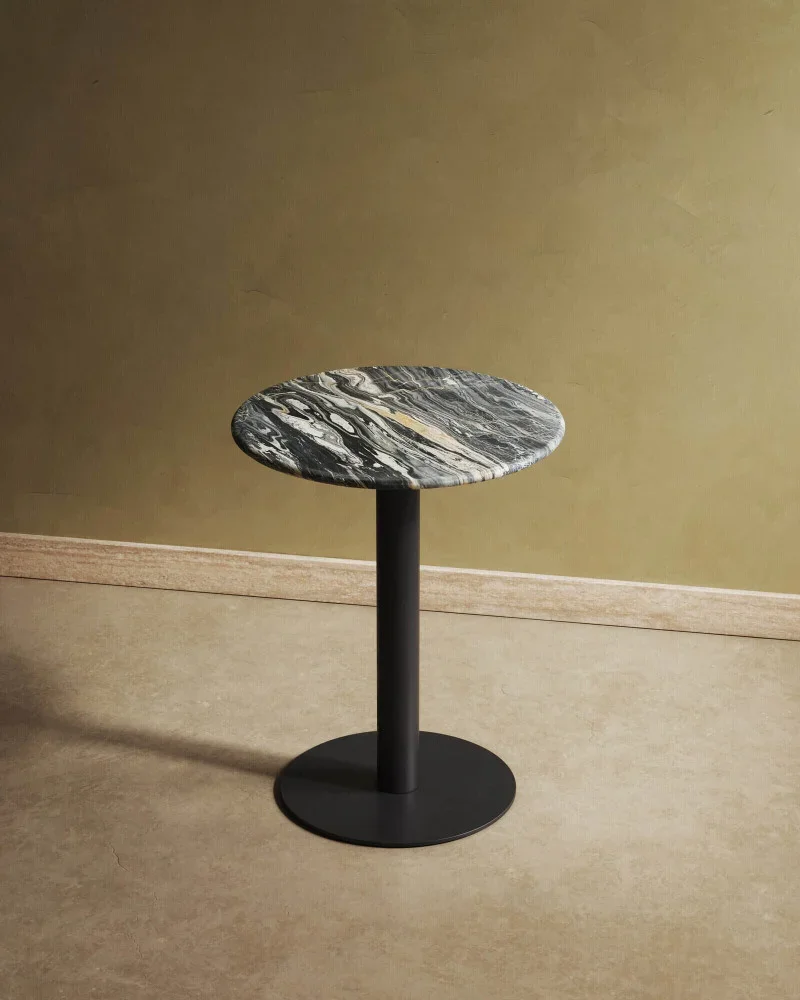 A blue marble bistro table on a beige backgound