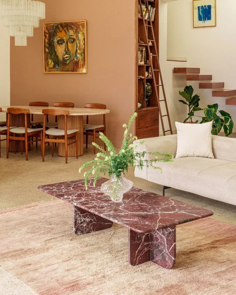 Living room with beige couches and a marble coffee table