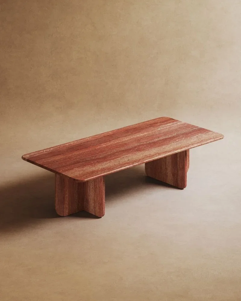 A travertine coffee table on a beige background