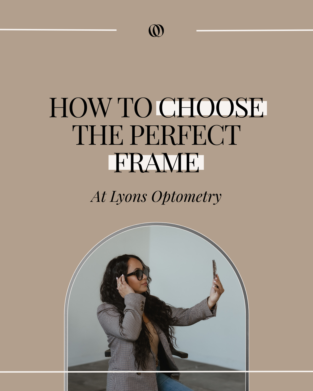 A woman with long dark hair wearing sunglasses taking a selfie with her phone, sitting in a modern optometry office with a light-colored wall and arched doorway.