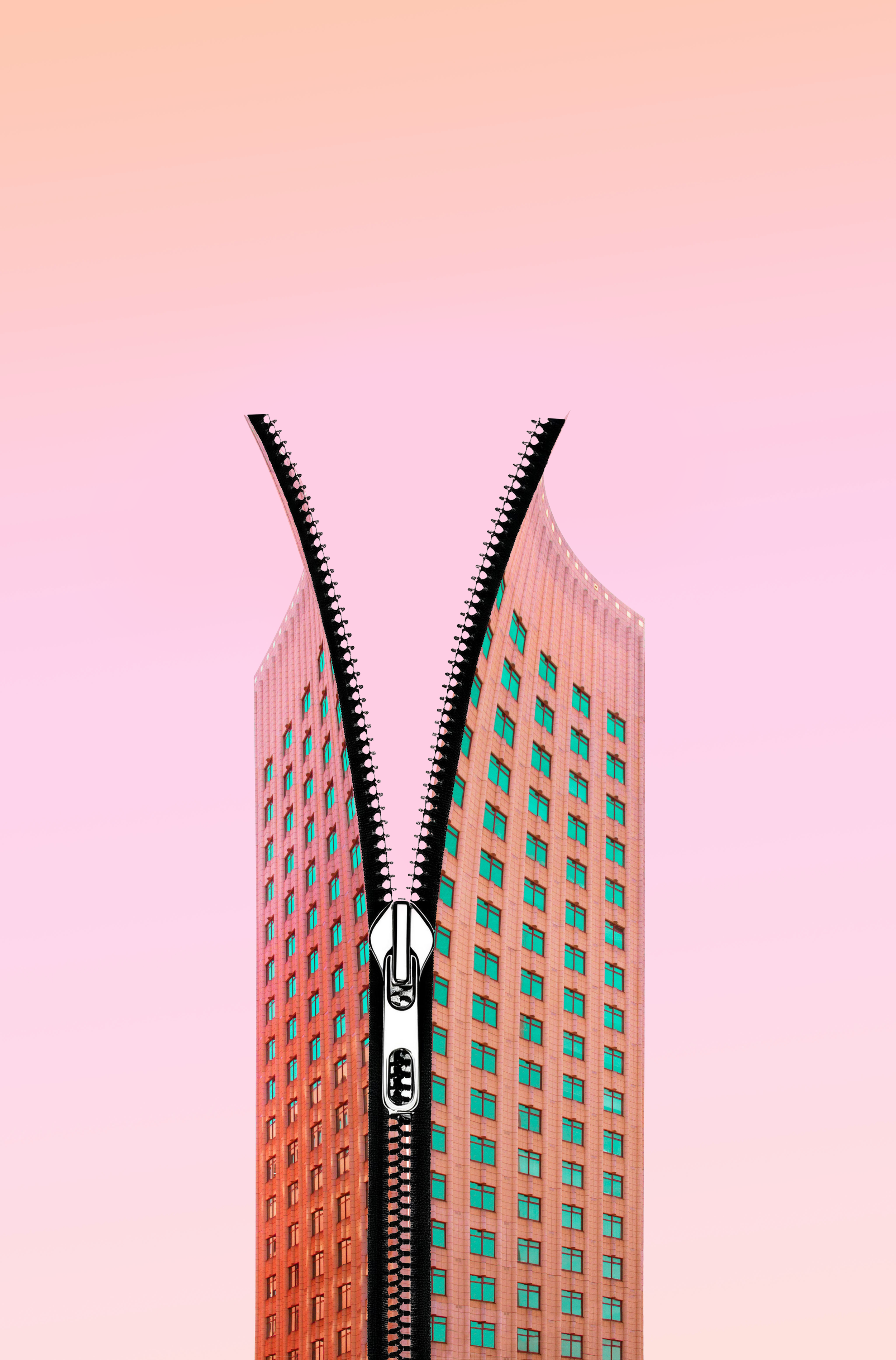 A tall pink skyscraper with teal windows and a zipper running down the middle, creating the illusion of the building opening like a zip.