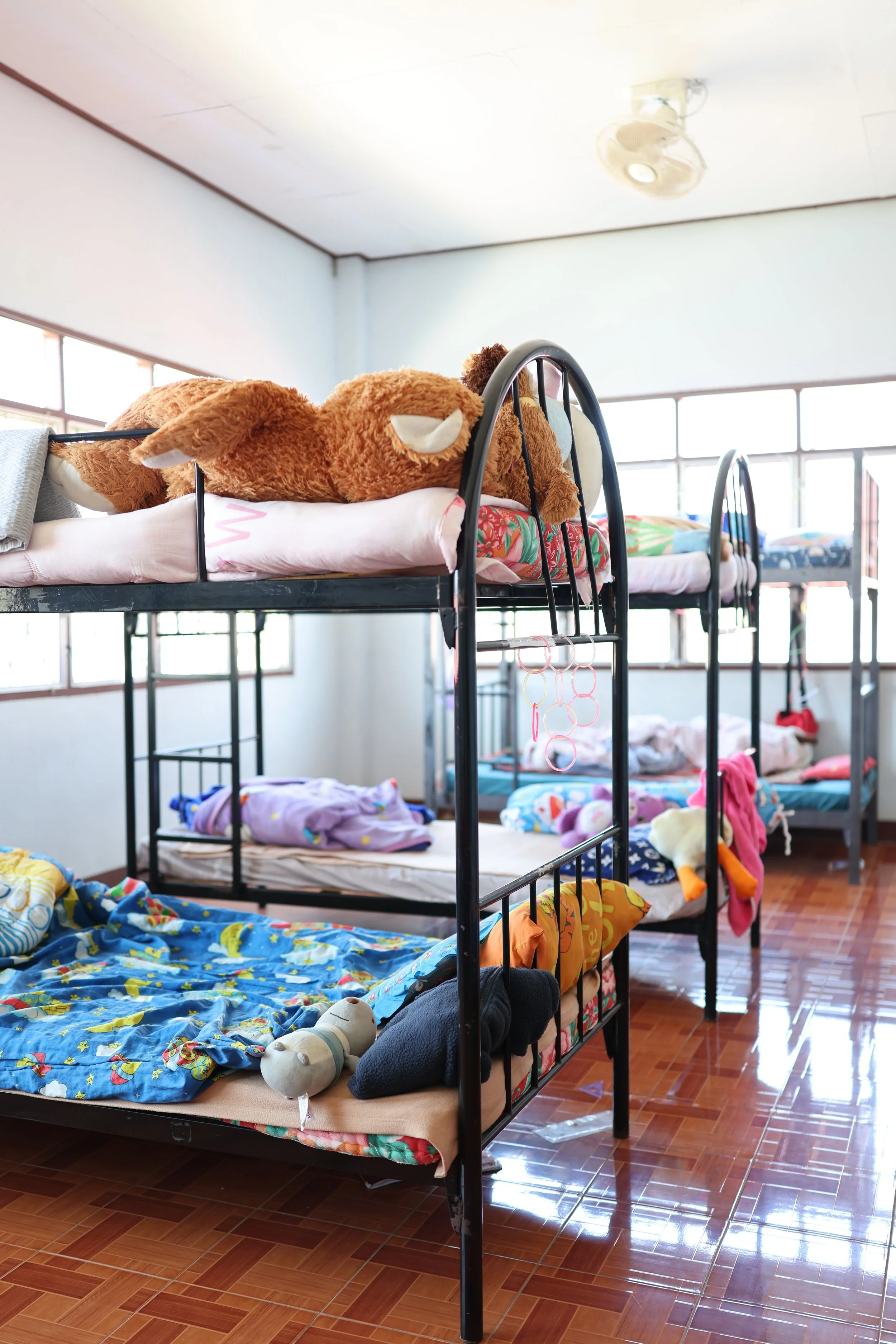 The bedrooms do not have air conditioning, causing temperatures to become extremely uncomfortable during the hottest months. Many girls choose to sleep on the floor because it is cooler than their beds.