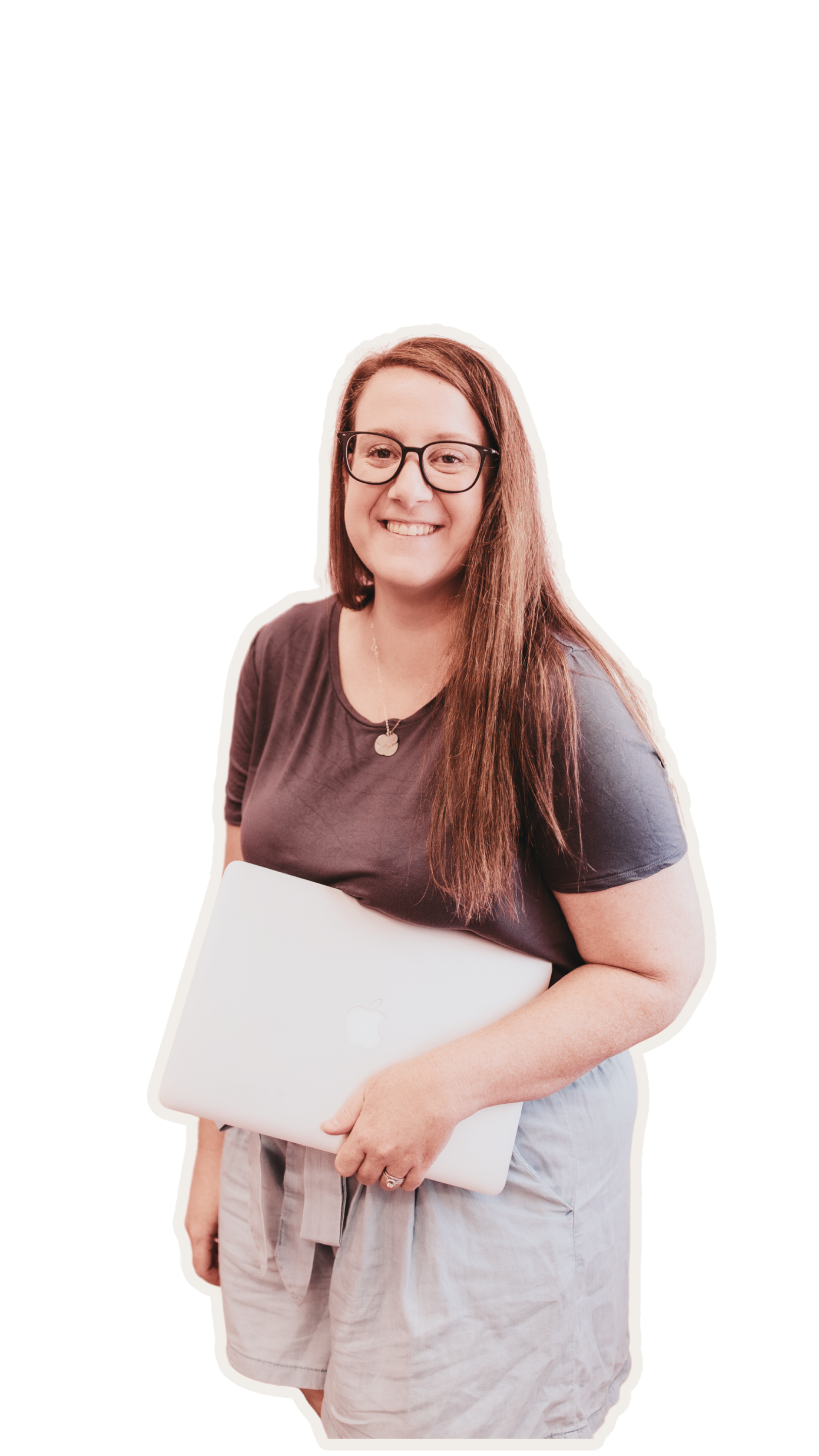 Carly Smith, Bold Vibes Marketing is wearing her glasses, has long brown hair while holding a closed silver MacBook. She is smiling, wearing a dark t-shirt and a necklace, with denim shorts.