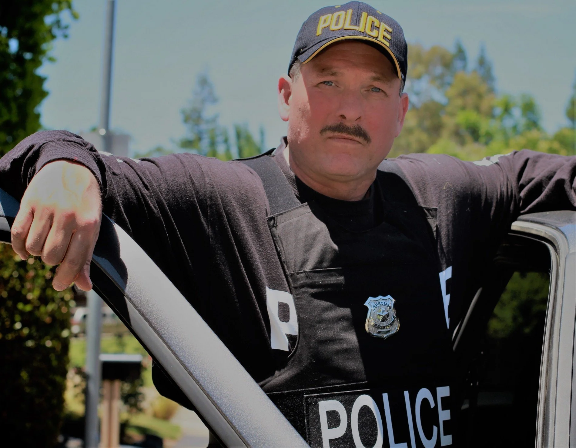 Anthony A. Snow as a Police Officer.