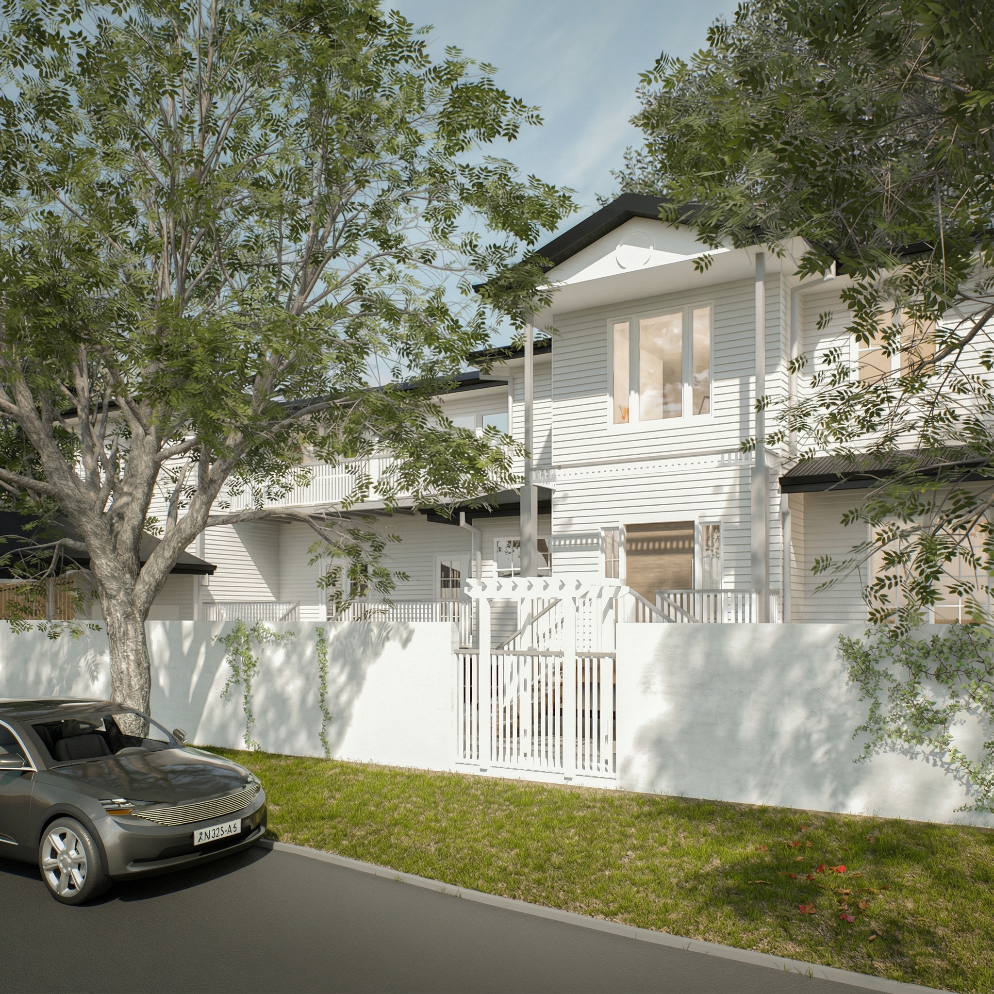 A modern two-story white house with a front gate, surrounded by trees and on a street with a parked car.