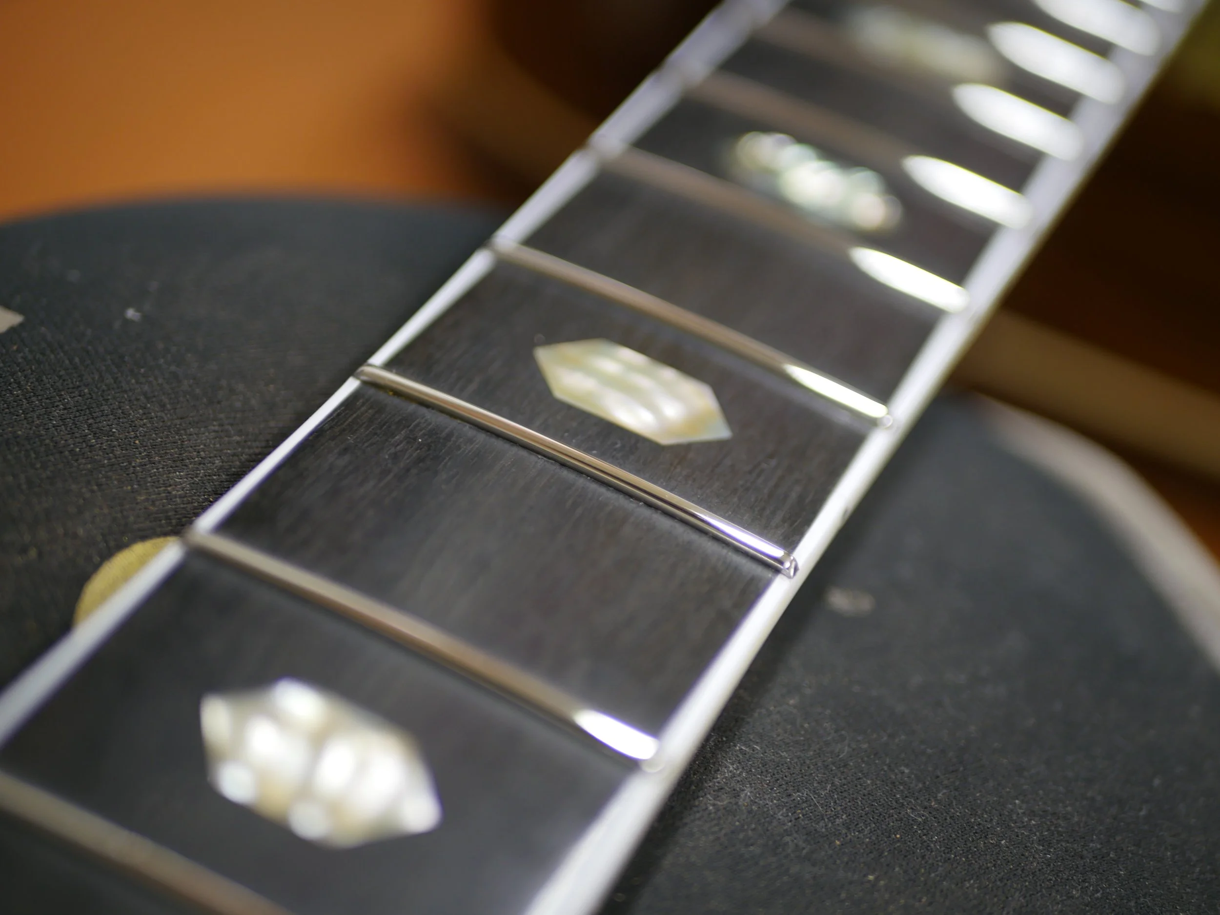 This is a Stainless Steel Refret i did on Country Singer, Braxton Keiths Martin D-41.
Fretwire is .090 x .055" Stainless Steel radiused to 16" over this Bound Ebony fretboard