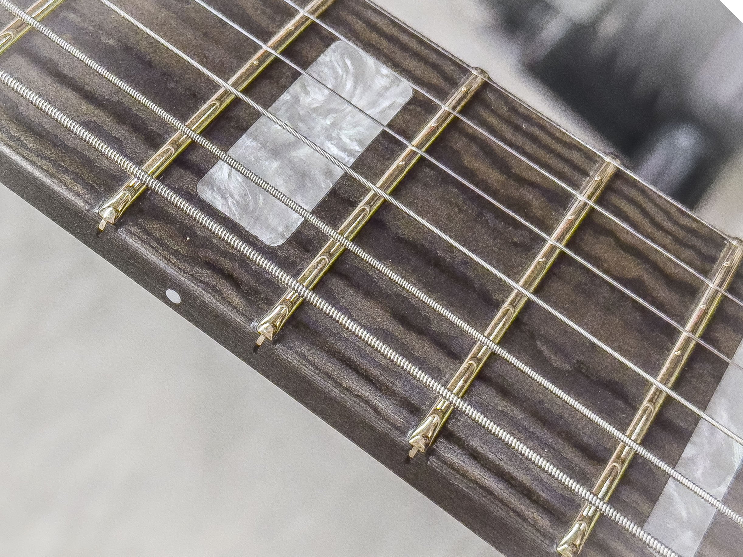 This is the fresh fret job on a Polo "Model J" made for Jeremy Plato of the band, Cross Canadian Ragweed.
.050" x .085" EVO Gold Fretwire installed over a deluxe Richlite Fretboard 